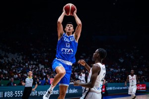 Italy survives battle with Angola in opening game